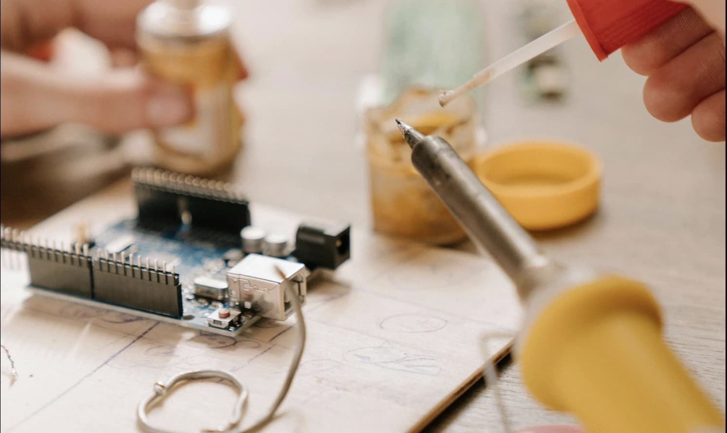 Technician calibrating an environmental sensor node for field monitoring